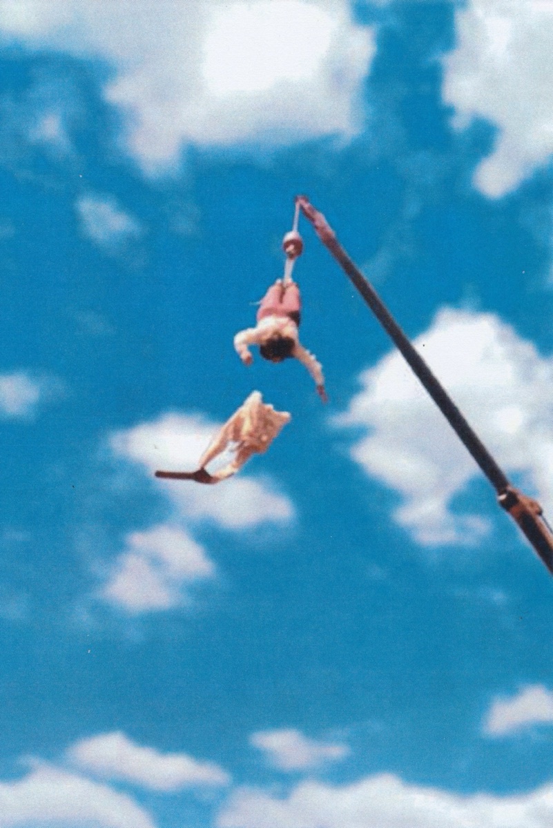 A straitjacket escape, upside down, a hundred feet up.
